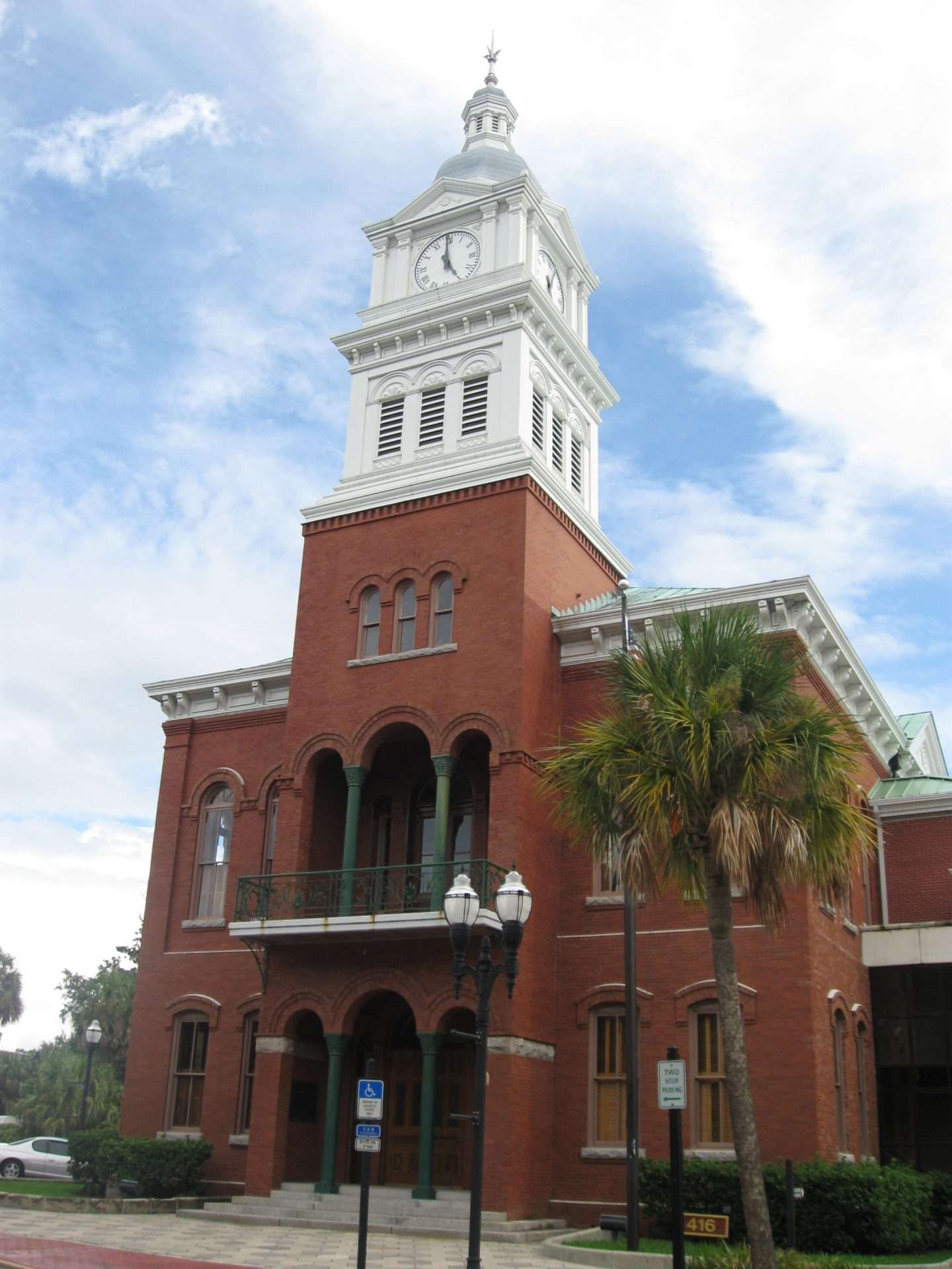 Historic red-brick courthouse with white clock tower